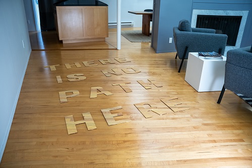 Art displayed on wood floor