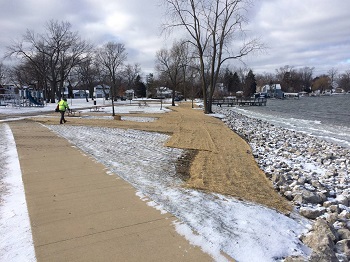 Waters edge with rocks and snow