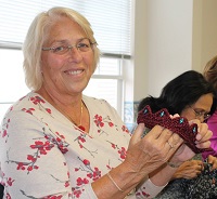 Woman taking a knitting class